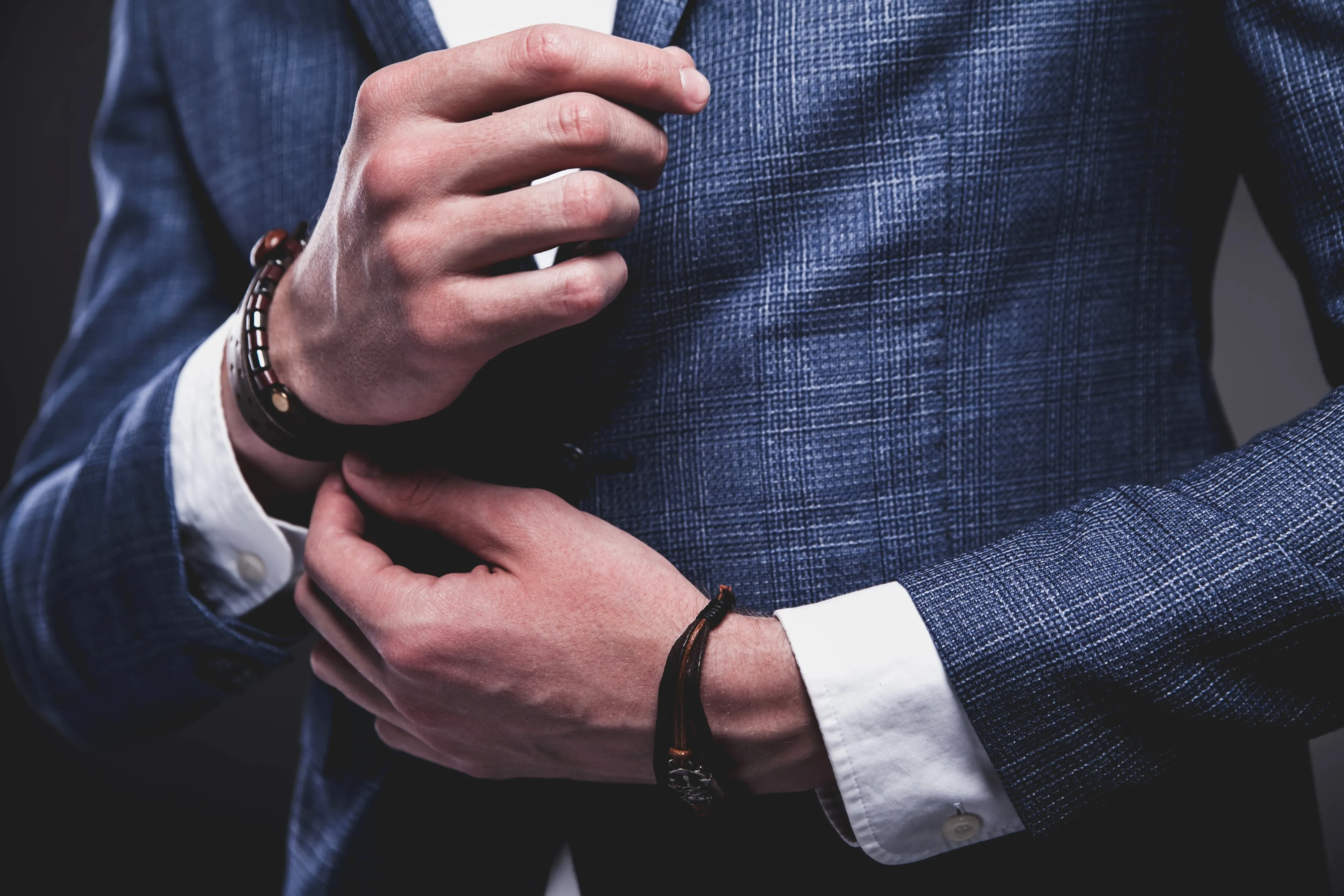 fashion-portrait-young-businessman-handsome-model-man-dressed-elegant-blue-suit-gray